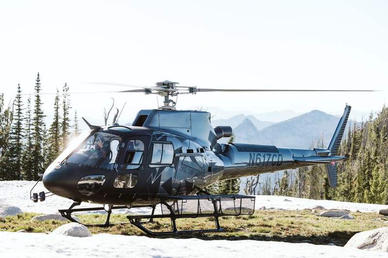 Helicopter parked on an alpine landing zone