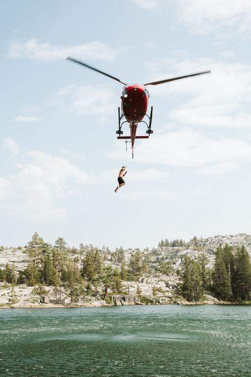 Helicopter operating on a long line above water
